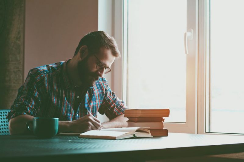 Author writing a book