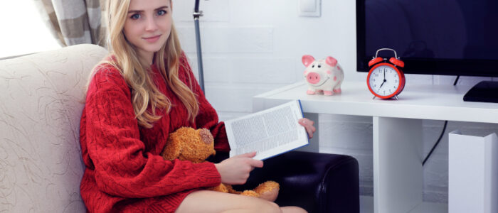 A teenager reading a book